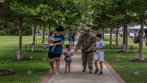 Military family walking outside