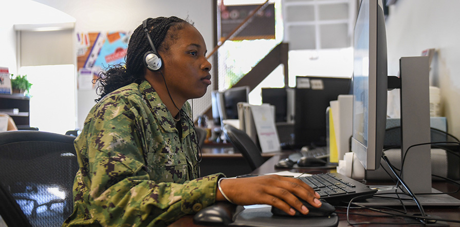 service member on computer