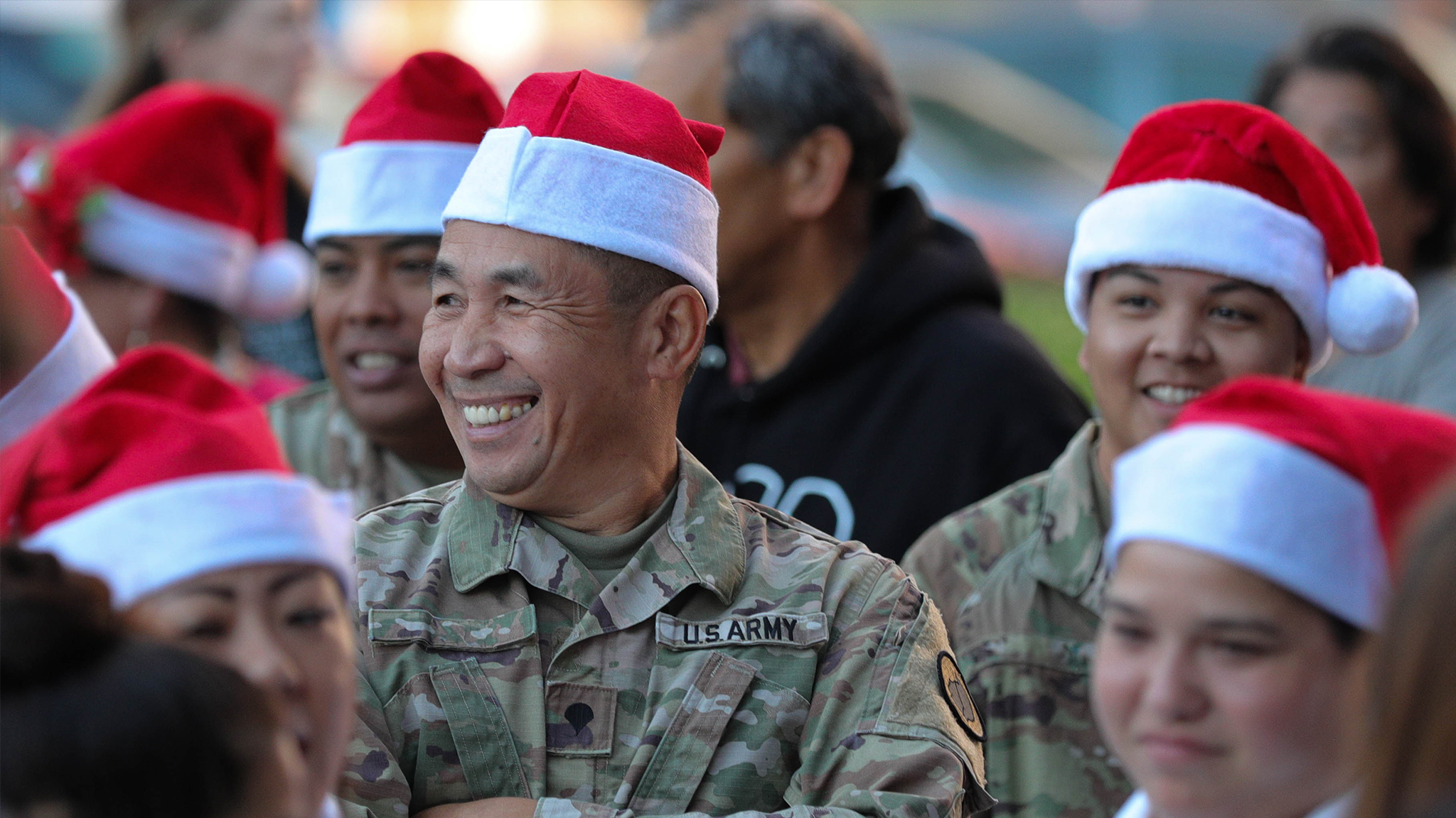 Service members in Santa hats