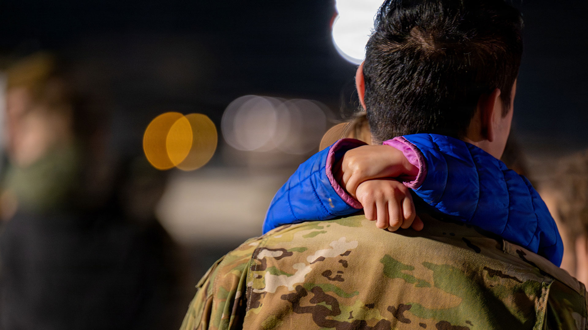 Child hugging parent