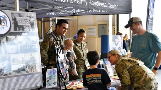 Military and Family Readiness table talking to families at event