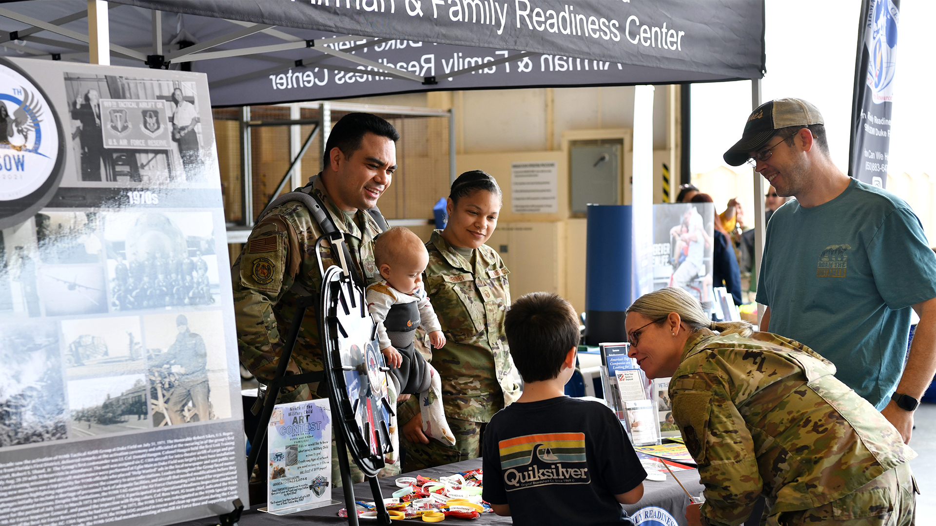Military and Family Readiness table talking to families at event