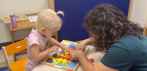 Child care provider working with child