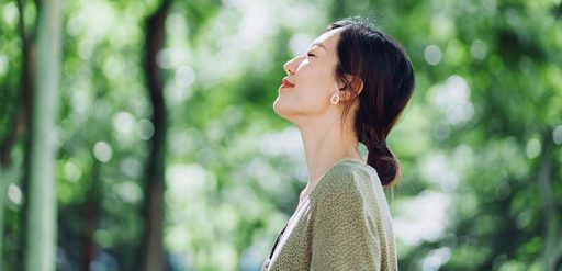 Woman taking deep breath