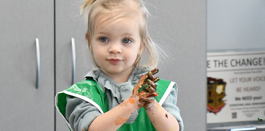 Child playing with paints