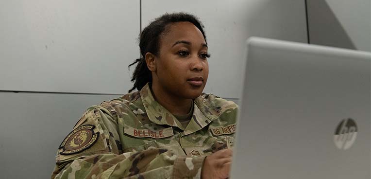 service member on computer