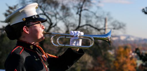 Marine bugler plays taps during wreath ceremony