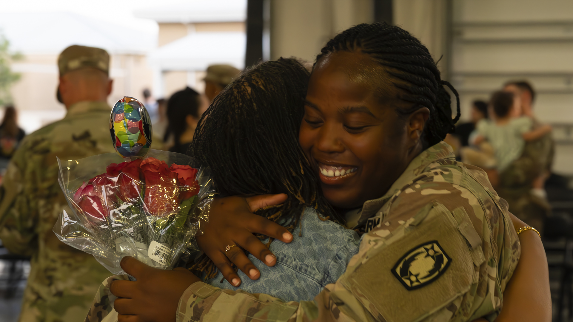 service member embracing loved one