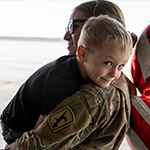 child being held by mother