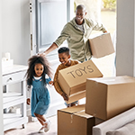 Father and children with moving boxes