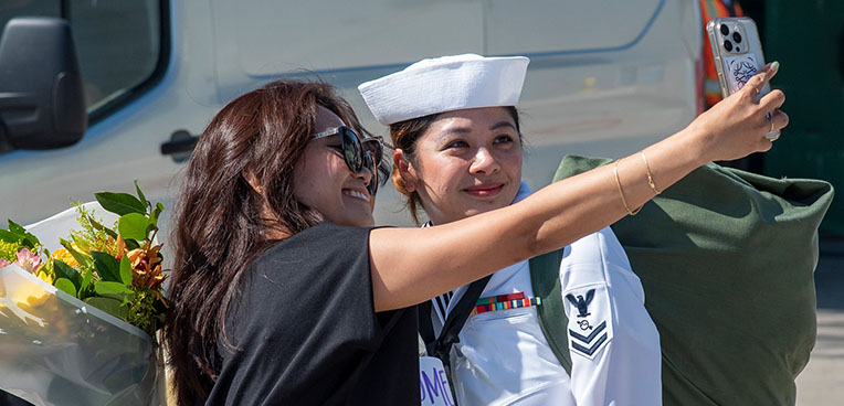 service member taking selfie with loved one