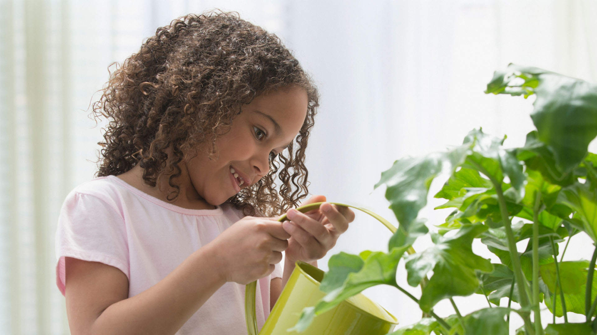 Girl watering plant