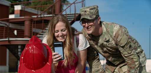 Parents taking photo of child