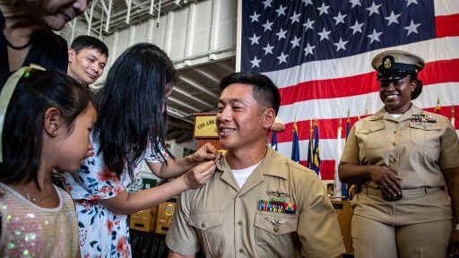 Service member is pinned by his family