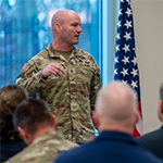 service member speaking at meeting