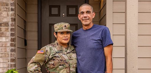 Service member standing with spouse
