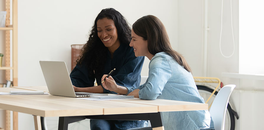two women working on computer