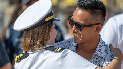 Service member hugging family member