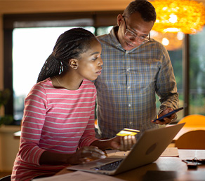 Couple looking at laptop
