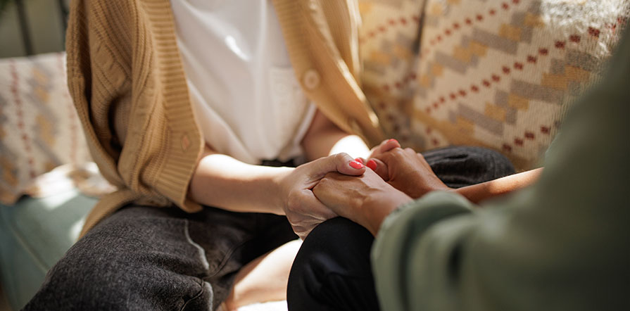 holding hands in comfort
