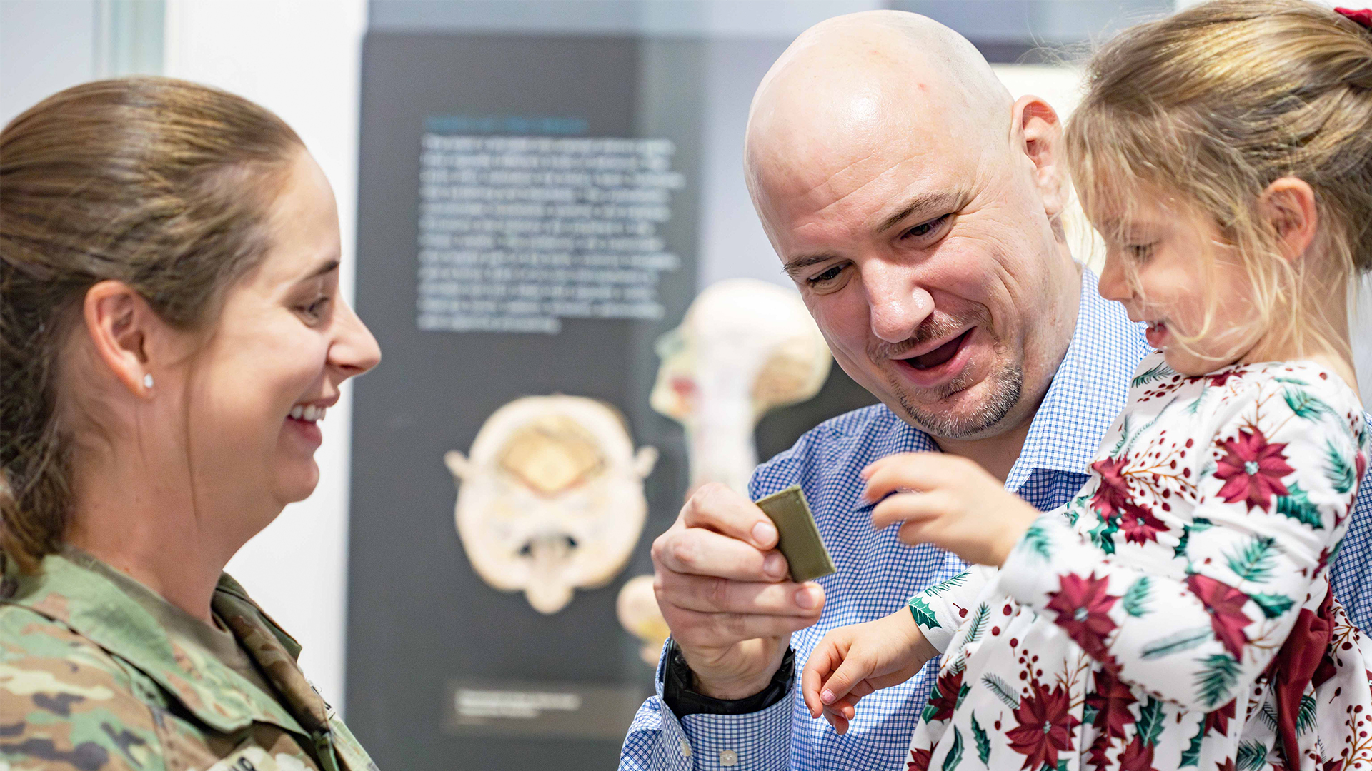 pinning ceremony with servicemember and family