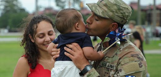 service member greeting baby