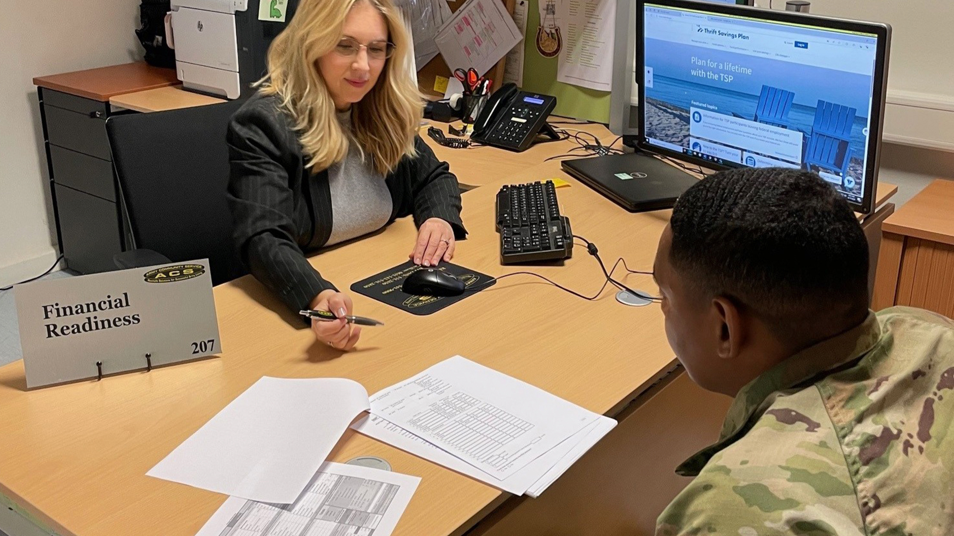 Service member reviewing finances with advisor