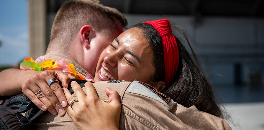 couple embracing after deployment