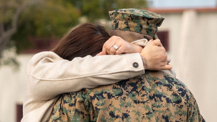 Service Member hugging loved one