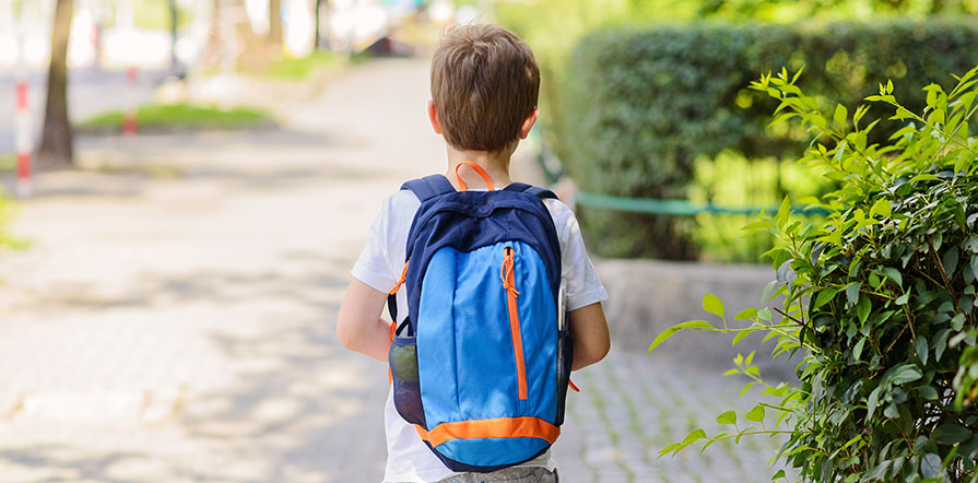 boy walking home from school