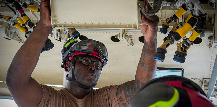 service member performs maintenance