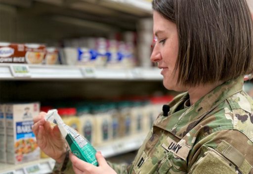 Service member reads product nutrition information