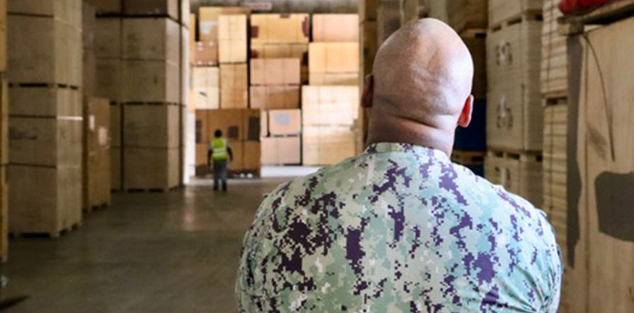 Service member views household goods