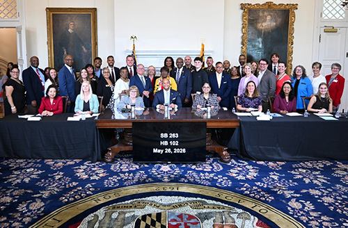 Maryland officials and military families at bill signing ceremony