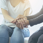 counselor comforting a woman