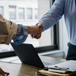 Man shaking a woman’s hand