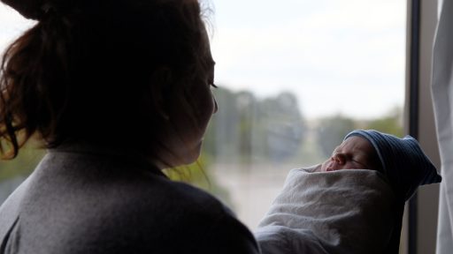 Mother holding new baby
