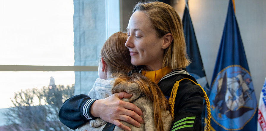 service member hugging loved one