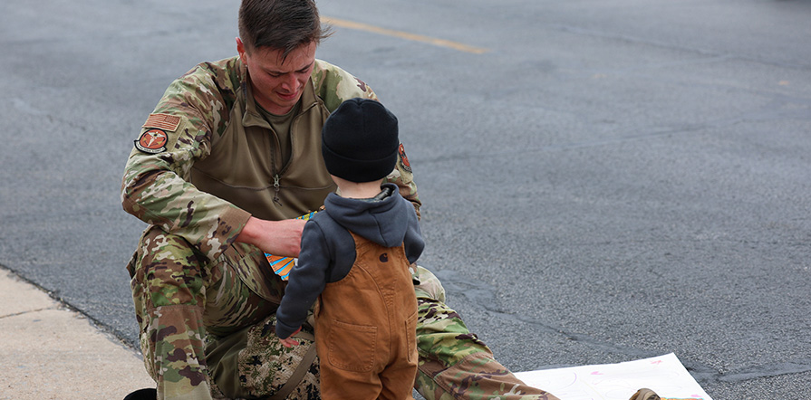 service member with child
