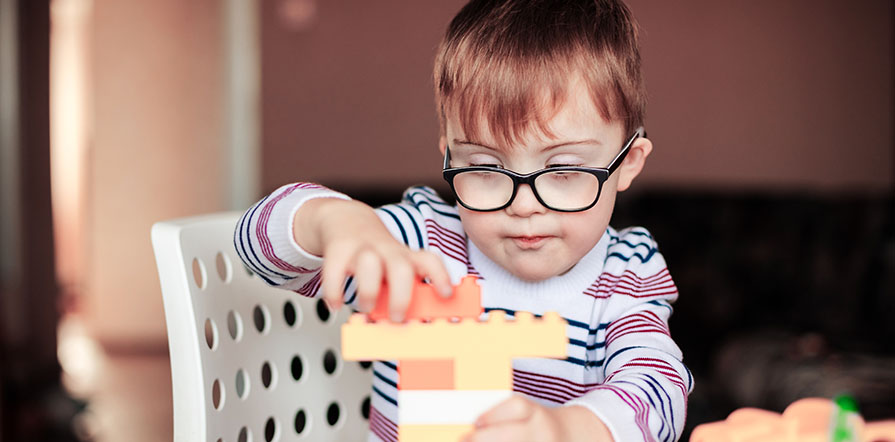 child plays with blocks