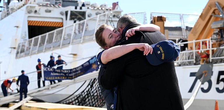 coast guard member hugs loved one