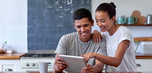 couple looking at tablet