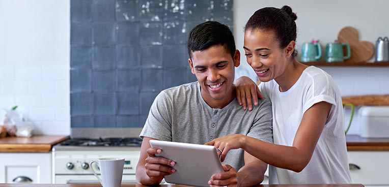 couple looking at tablet