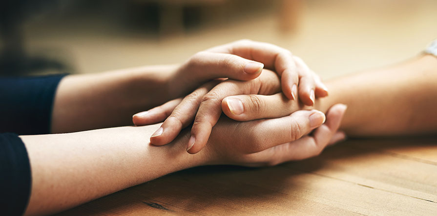 holding hands in comfort