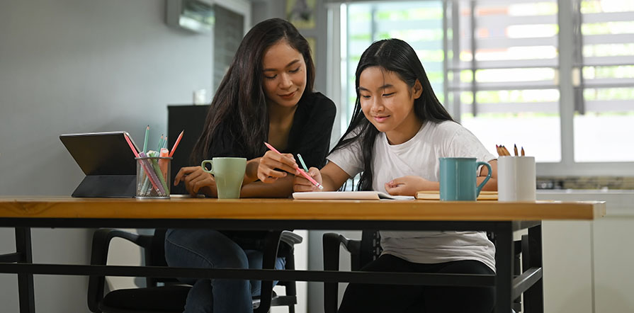 mother and child doing schoolwork