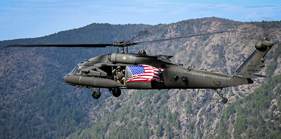 saluting the American flag during training mission
