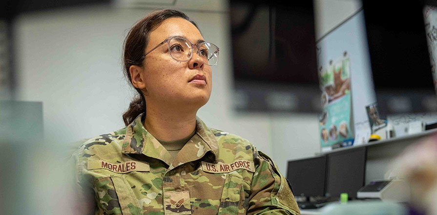 service member looking at computer