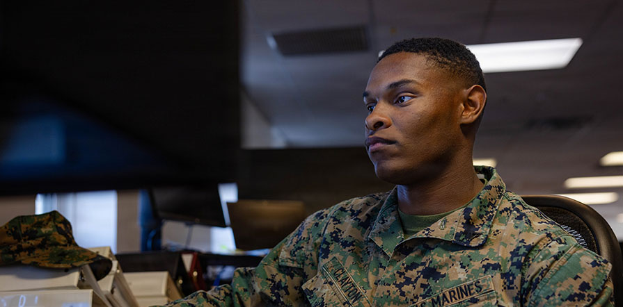 service member on computer