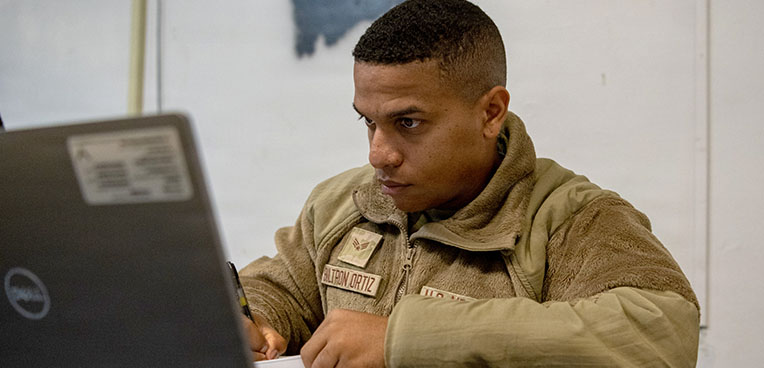service member on computer