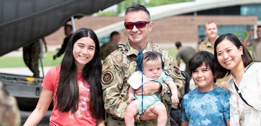 service member with family after deployment